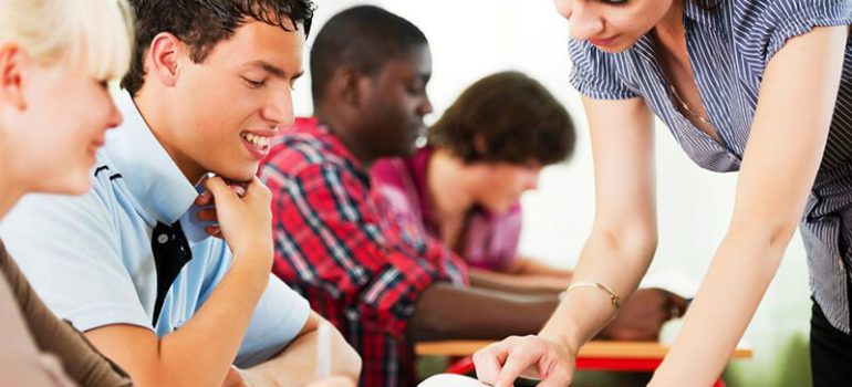 Student preparing for standardized tests with a tutor