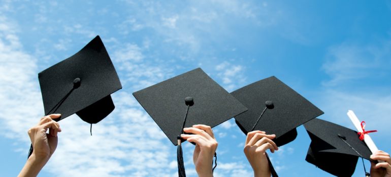 Student celebrating college acceptance after essay coaching